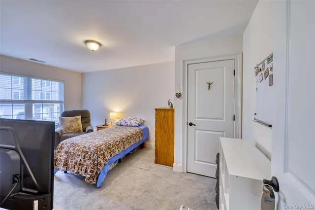 a bedroom with a bed and a cabinets