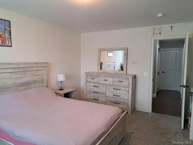 a bedroom with a bed and a cabinets