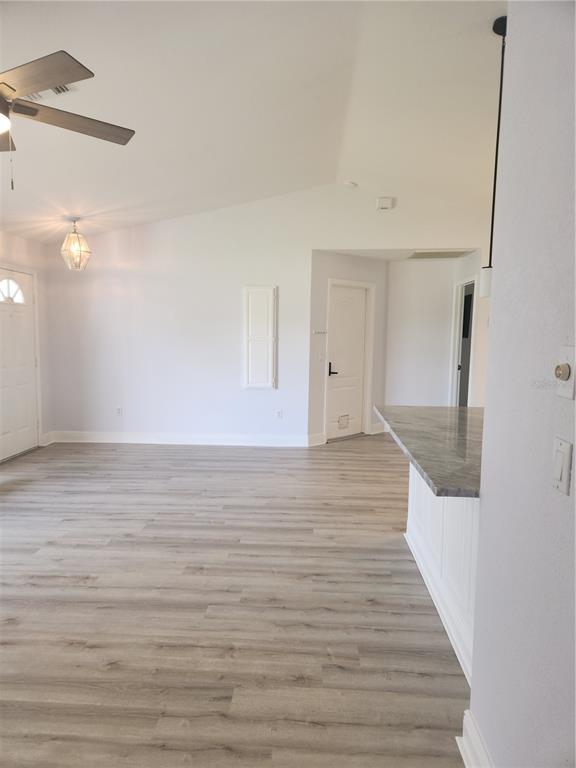 26270 Explorer Road Punta Gorda, FL 33983 - Photo 11 of 22 a view of a room with wooden floor and staircase