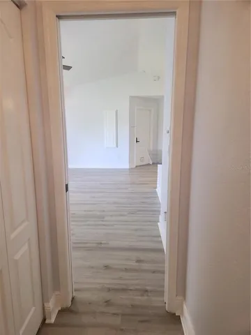 a view of door with wooden floor