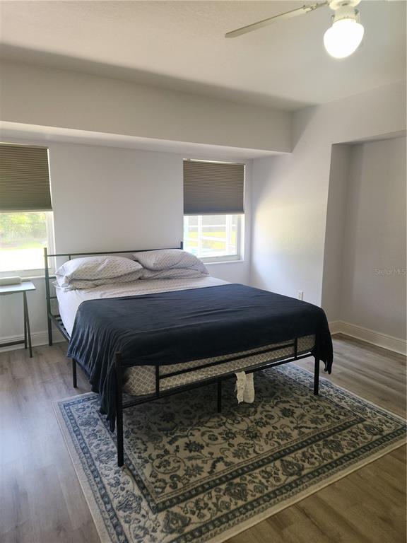 26270 Explorer Road Punta Gorda, FL 33983 - Photo 13 of 22 a bed sitting in a bedroom next to a window