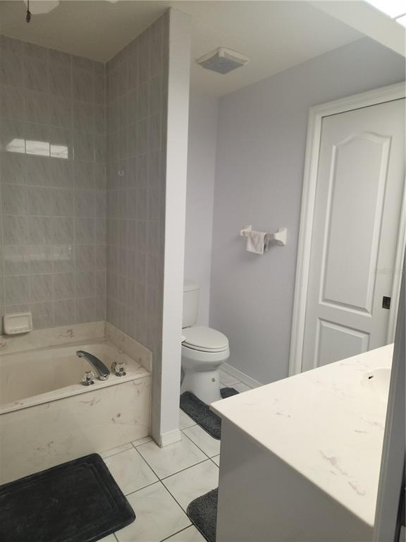 26270 Explorer Road Punta Gorda, FL 33983 - Photo 19 of 22 a bathroom with a sink a toilet and shower