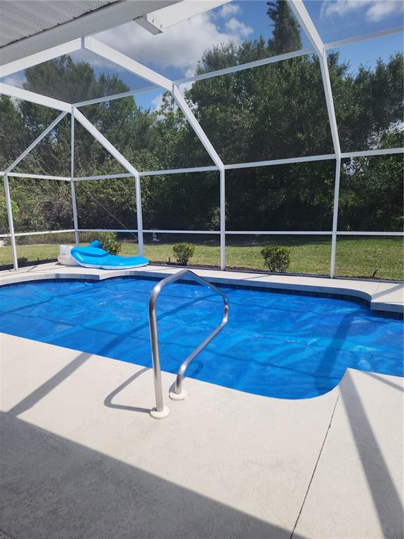 26270 Explorer Road Punta Gorda, FL 33983 - Photo 20 of 22 a view of outdoor space with swimming pool and porch