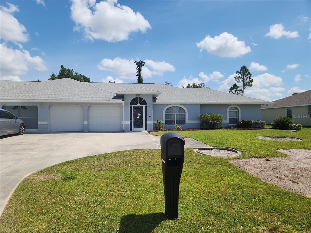 26270 Explorer Road Punta Gorda, FL 33983 - Photo 2 of 22 a front view of a house with garden