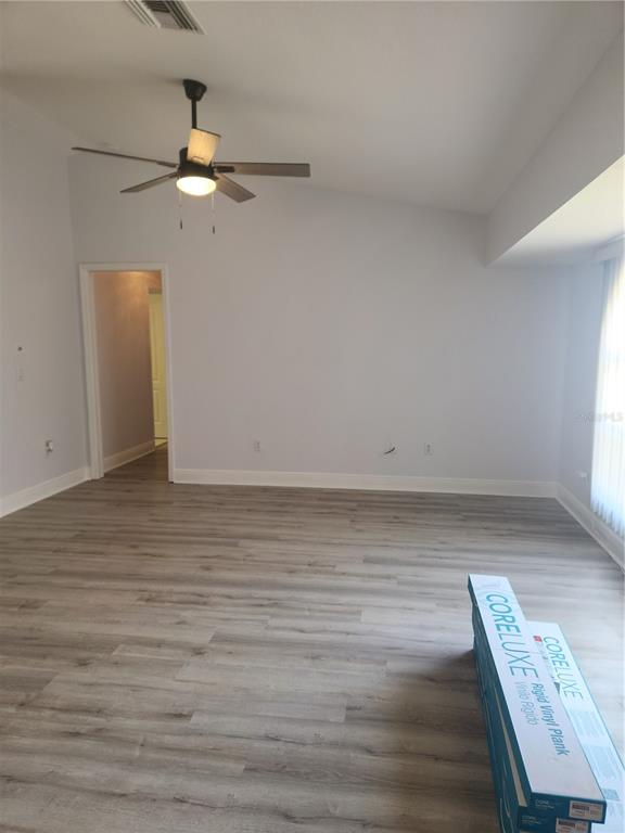 26270 Explorer Road Punta Gorda, FL 33983 - Photo 7 of 22 wooden floor in an empty room