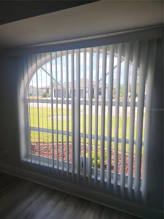 26270 Explorer Road Punta Gorda, FL 33983 - Photo 8 of 22 a view of a porch with wooden floor