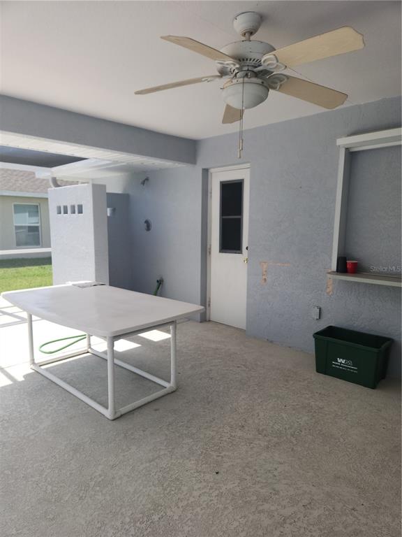 26270 Explorer Road Punta Gorda, FL 33983 - Photo 10 of 22 a living room with stainless steel appliances kitchen island granite countertop furniture and a flat screen tv