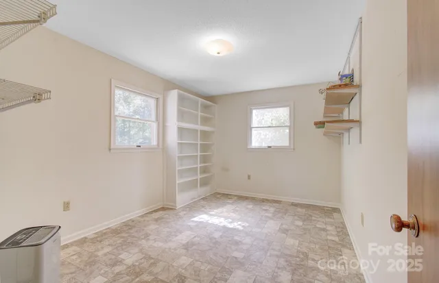 a view of an empty walk in closet