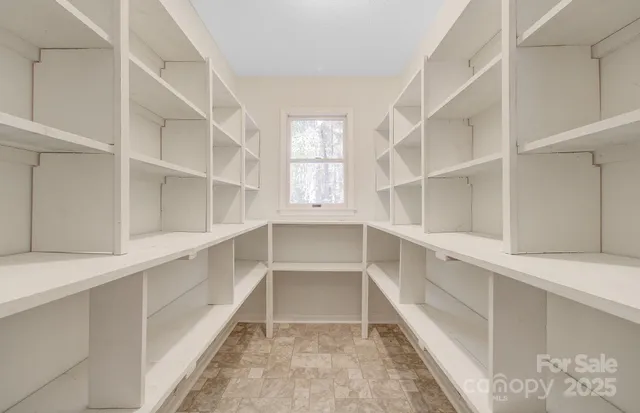 a view of entryway with wooden floor and window