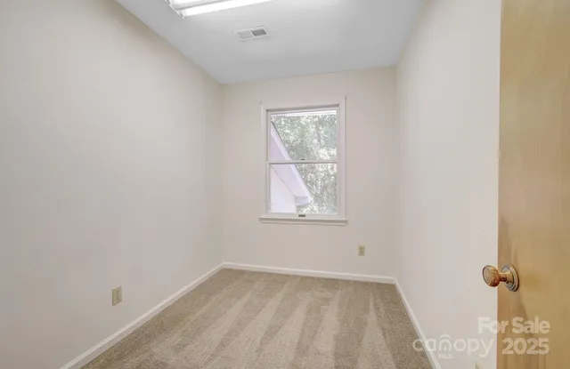 a view of a room with wooden walls