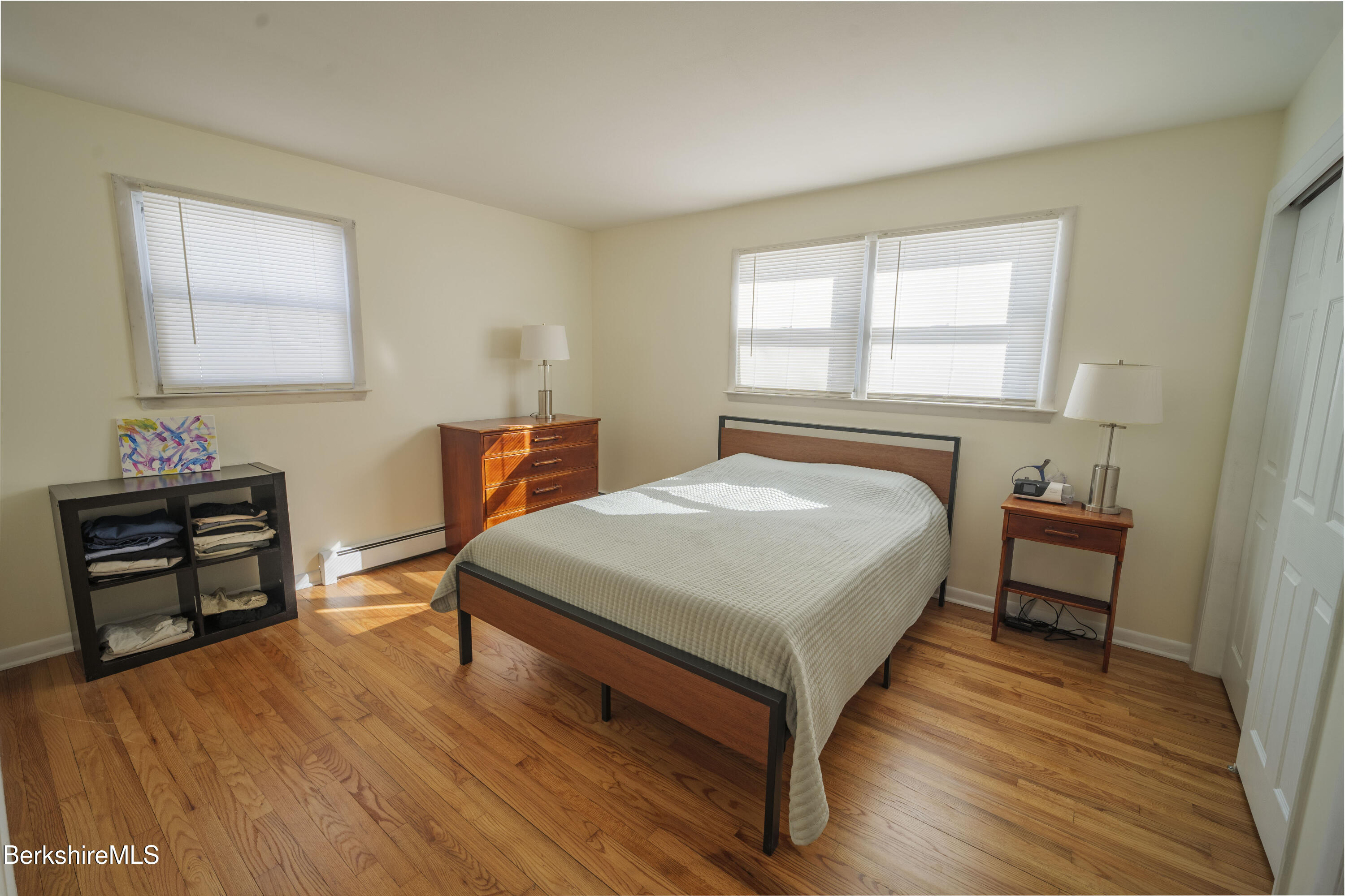 582 East New Lenox Road Pittsfield, MA 01201 - Photo 7 of 23 a bedroom with a bed and wooden floor