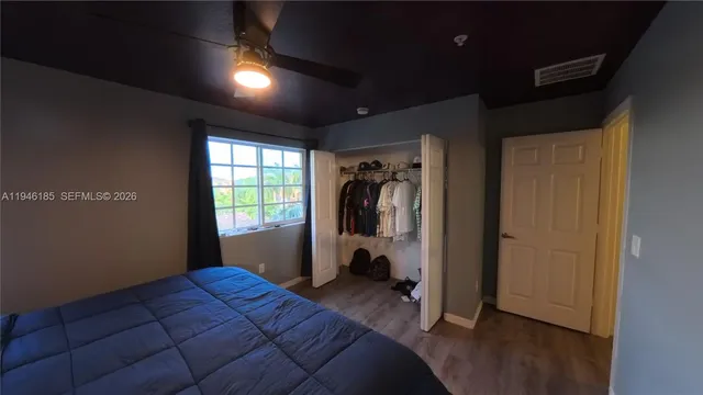 a bed room with a bed and a window