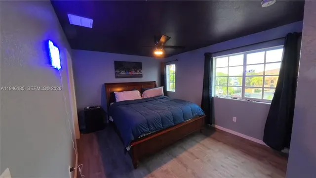 a bedroom with a bed and window