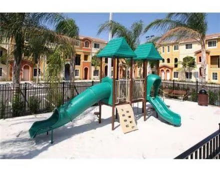 a view of a chairs and table in patio
