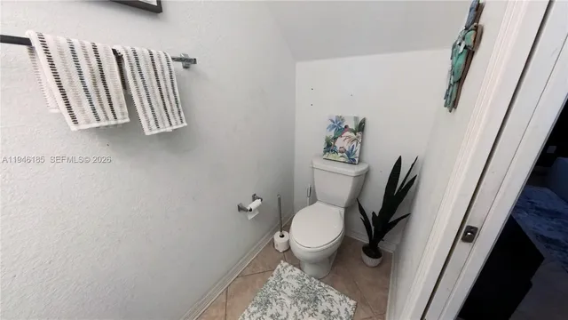 a bathroom with a toilet sink and tub