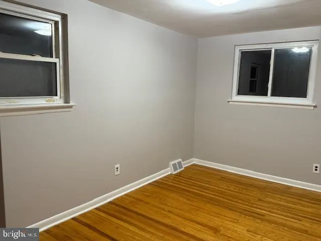 a view of a room with a empty space and window