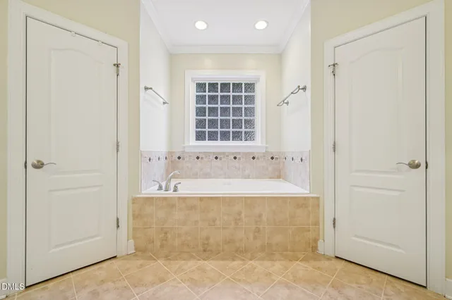 a bathroom with a bathtub and shower