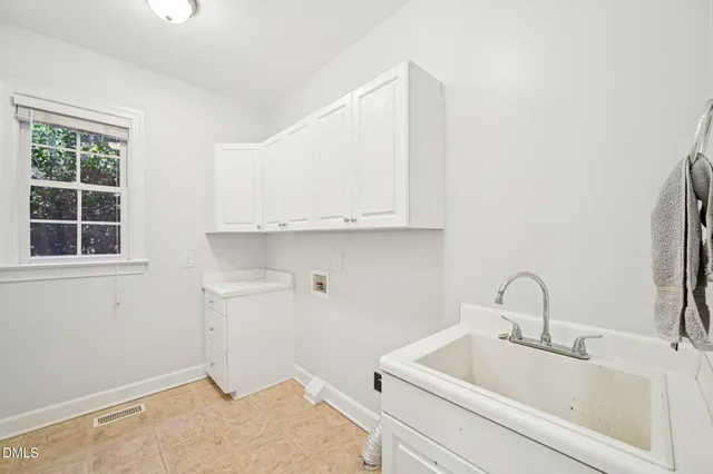 a bathroom with a sink and vanity
