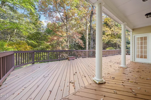 a view of balcony with wooden floor