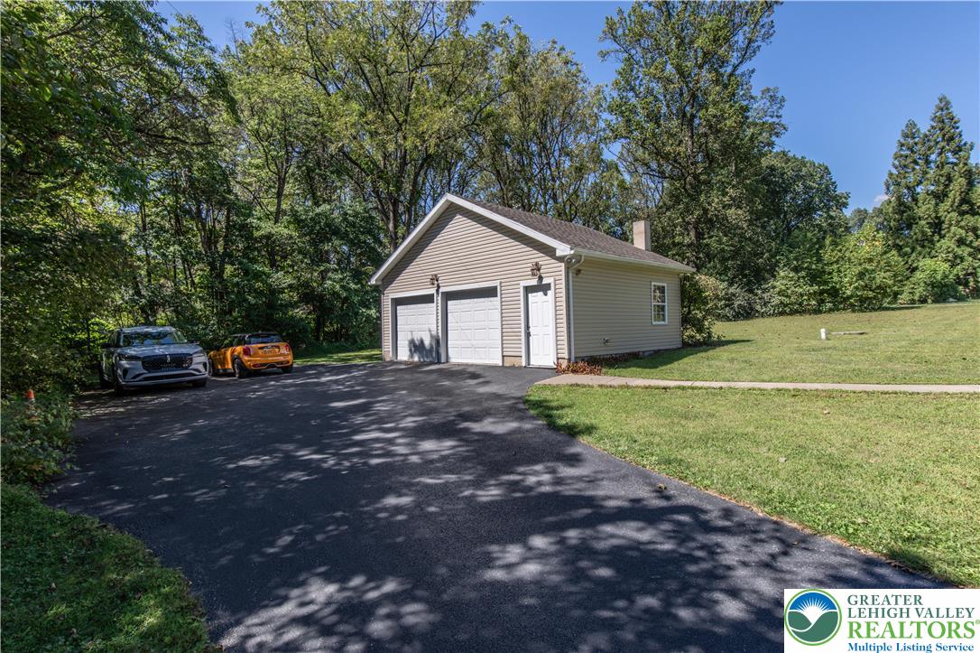 3256 Woodlea Road Orefield, PA 18069 - Photo 12 of 43 a front view of a house with a garden