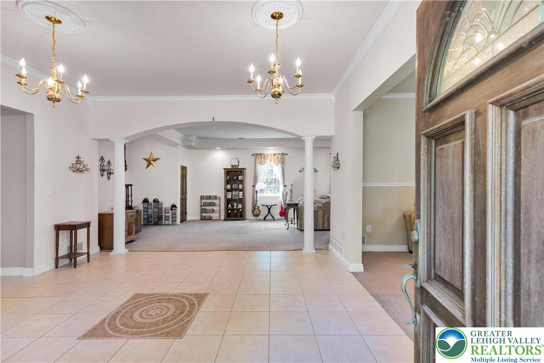 3256 Woodlea Road Orefield, PA 18069 - Photo 16 of 43 a view of a hallway with a chandelier