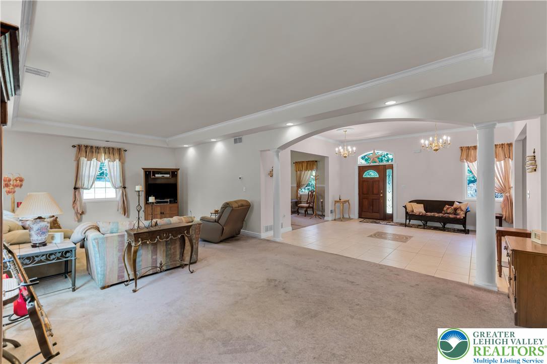 3256 Woodlea Road Orefield, PA 18069 - Photo 19 of 43 a living room with furniture and a flat screen tv