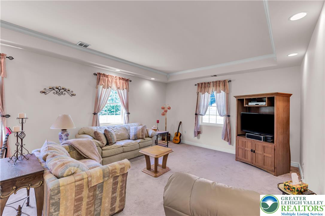 3256 Woodlea Road Orefield, PA 18069 - Photo 20 of 43 a living room with furniture and a flat screen tv