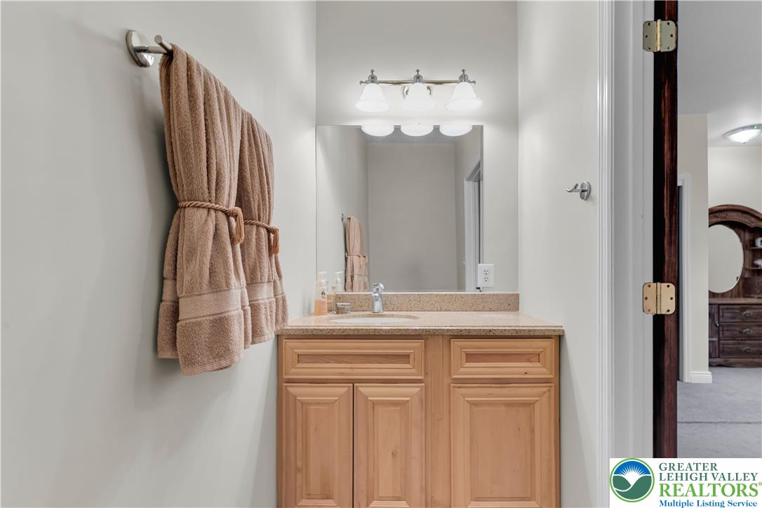 3256 Woodlea Road Orefield, PA 18069 - Photo 40 of 43 a bathroom with a sink and a mirror