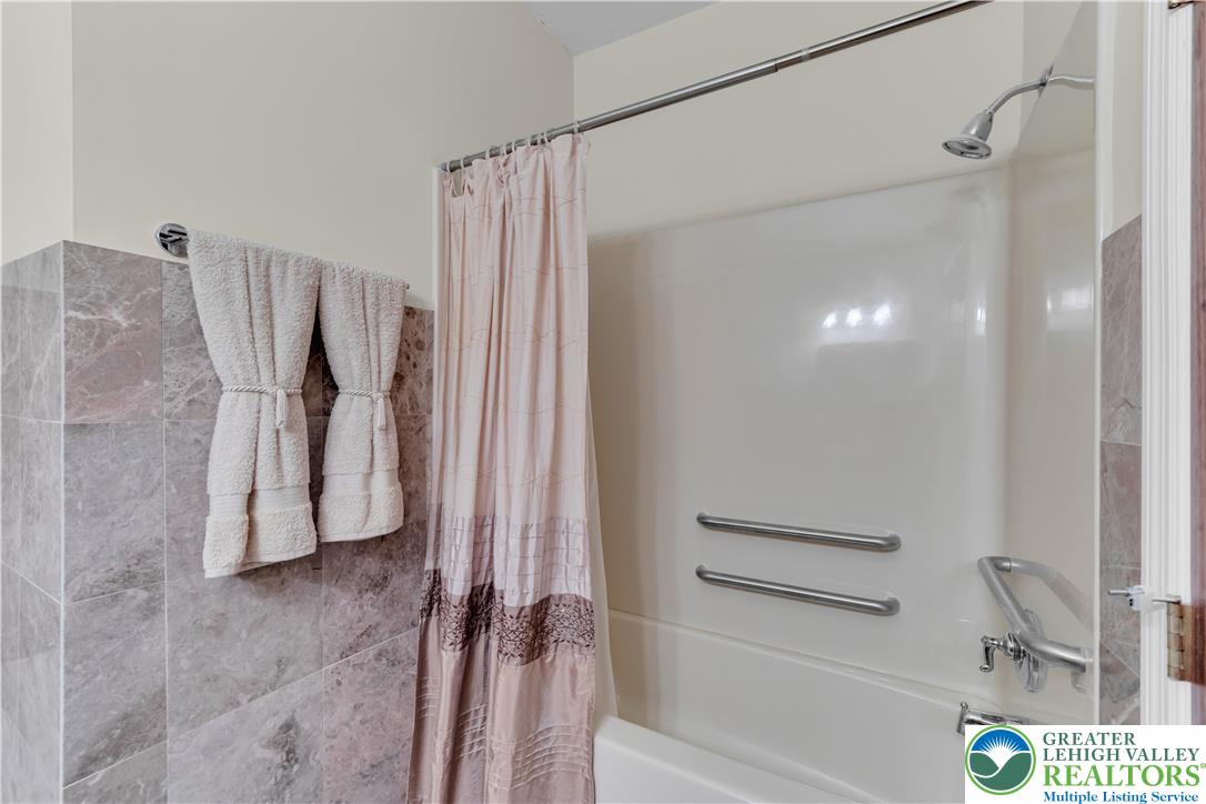 3256 Woodlea Road Orefield, PA 18069 - Photo 43 of 43 a bathroom with a shower and a tub