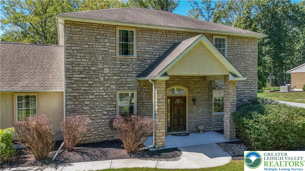 3256 Woodlea Road Orefield, PA 18069 - Photo 5 of 43 a front view of a house with garden