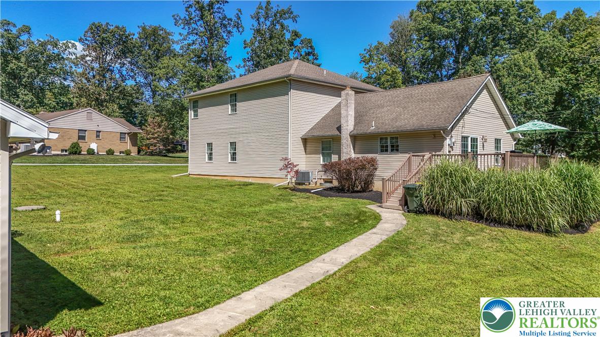 3256 Woodlea Road Orefield, PA 18069 - Photo 9 of 43 a view of a house with backyard and garden