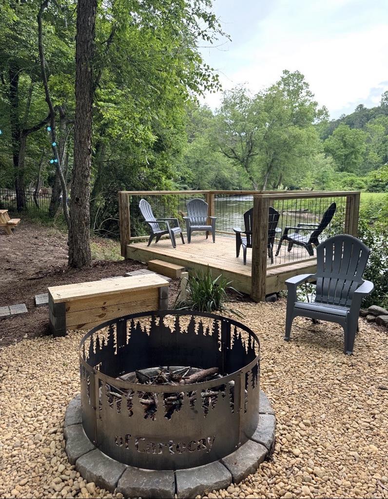 216 Old Orchard Road Ellijay, GA 30536 - Photo 57 of 59 a view of a chairs and table in the patio