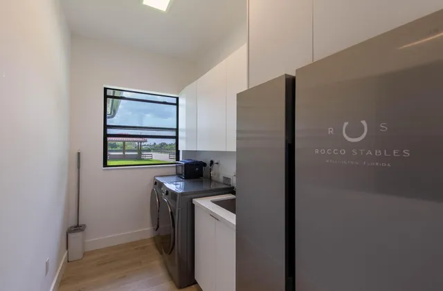 a kitchen with stainless steel appliances a refrigerator sink and stove