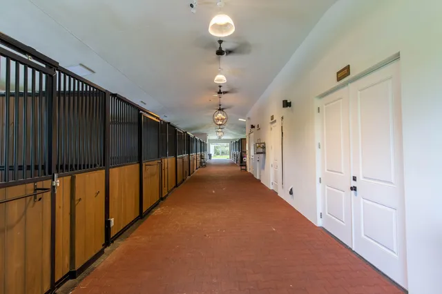 a view of a hallway with a chandelier