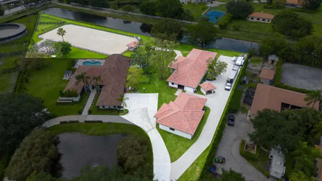an aerial view of a house with outdoor space
