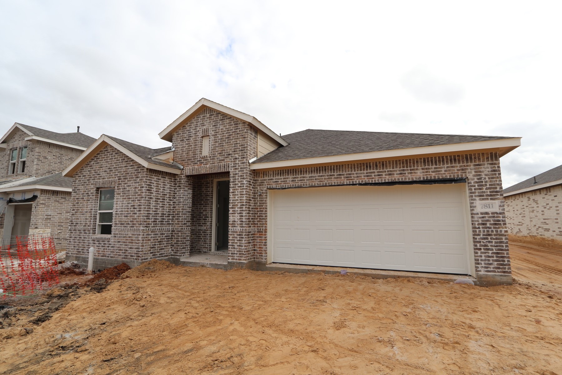7811 Jade Crest Drive Angleton, TX 77515 - Photo 2 of 30 front view of a house with a yard