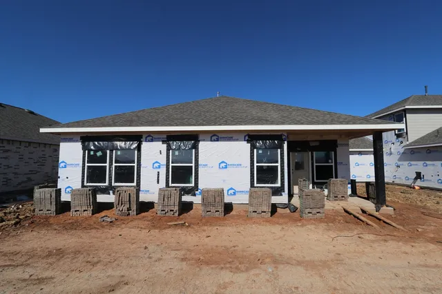 a front view of a house with a patio
