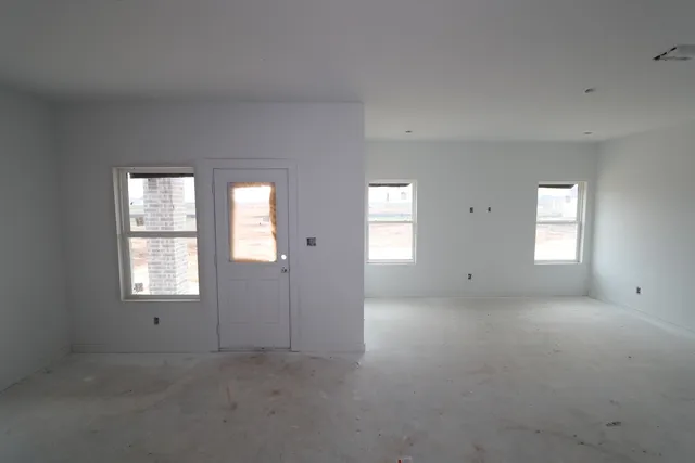 a view of empty room with windows