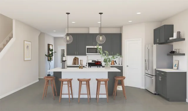 a kitchen with kitchen island a dining table chairs sink and cabinets