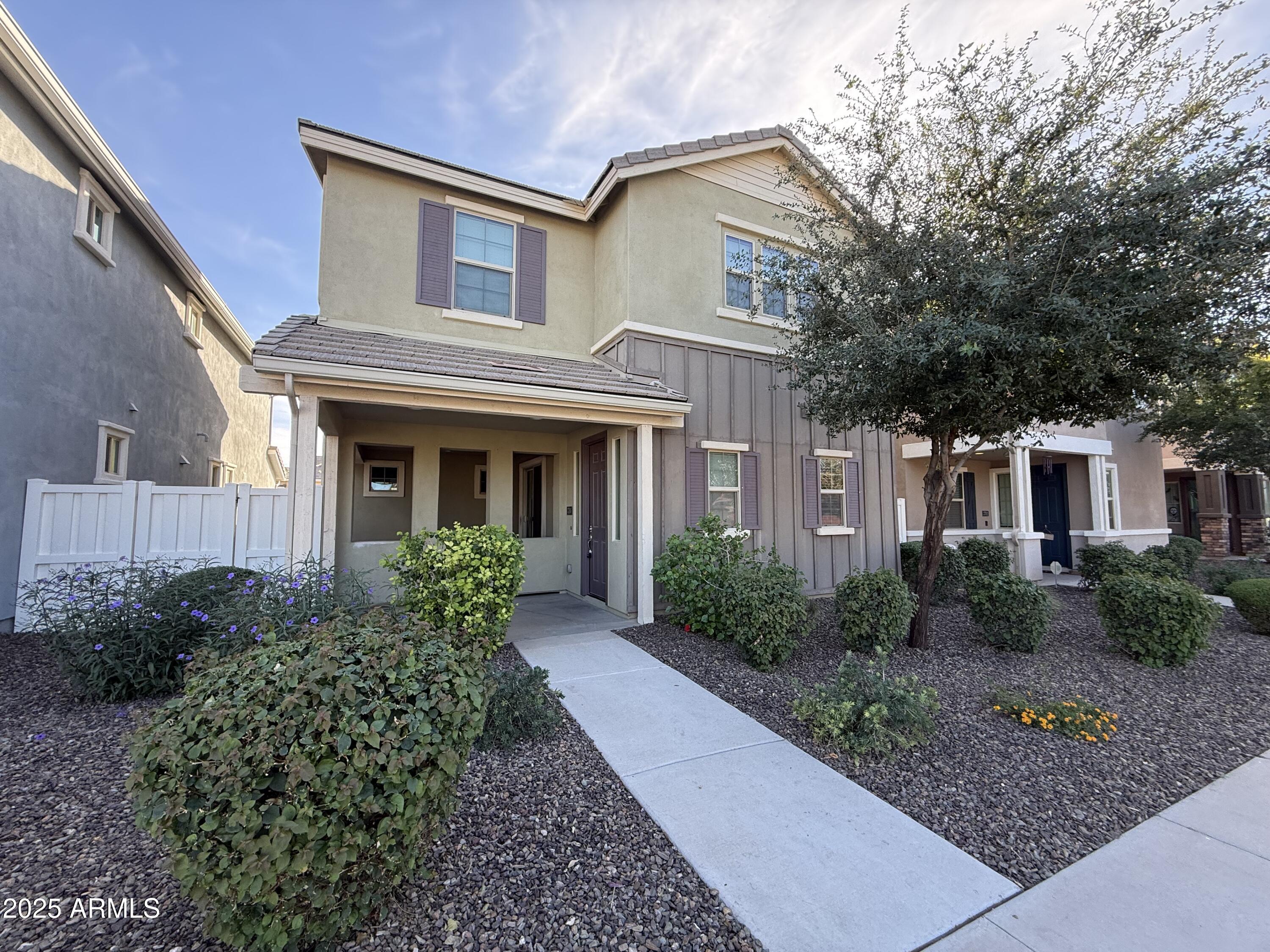 3786 East Robert Street Gilbert, AZ 85295 - Photo 1 of 22 a front view of a house with garden and plants