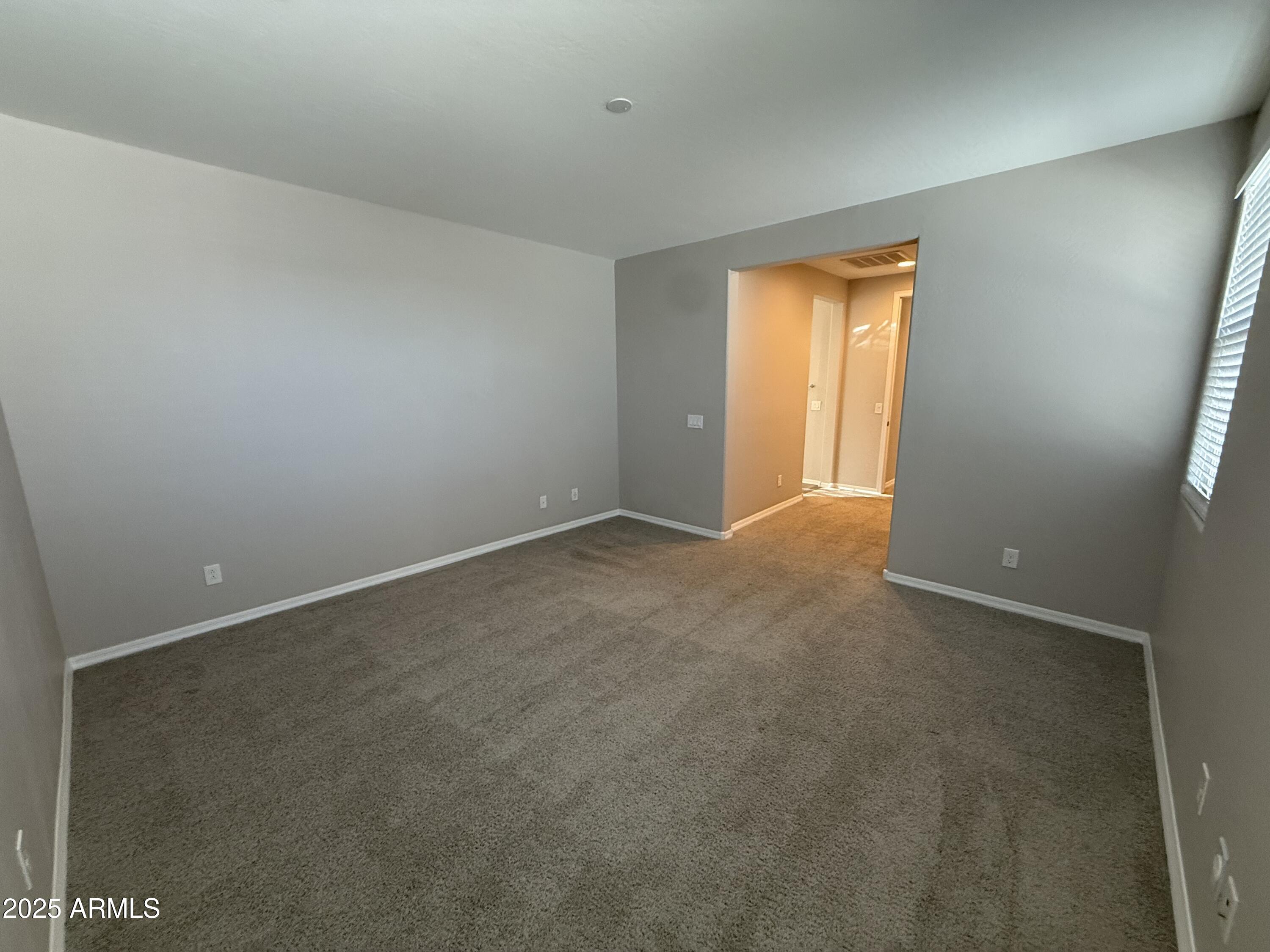3786 East Robert Street Gilbert, AZ 85295 - Photo 22 of 22 a view of an empty room with a window