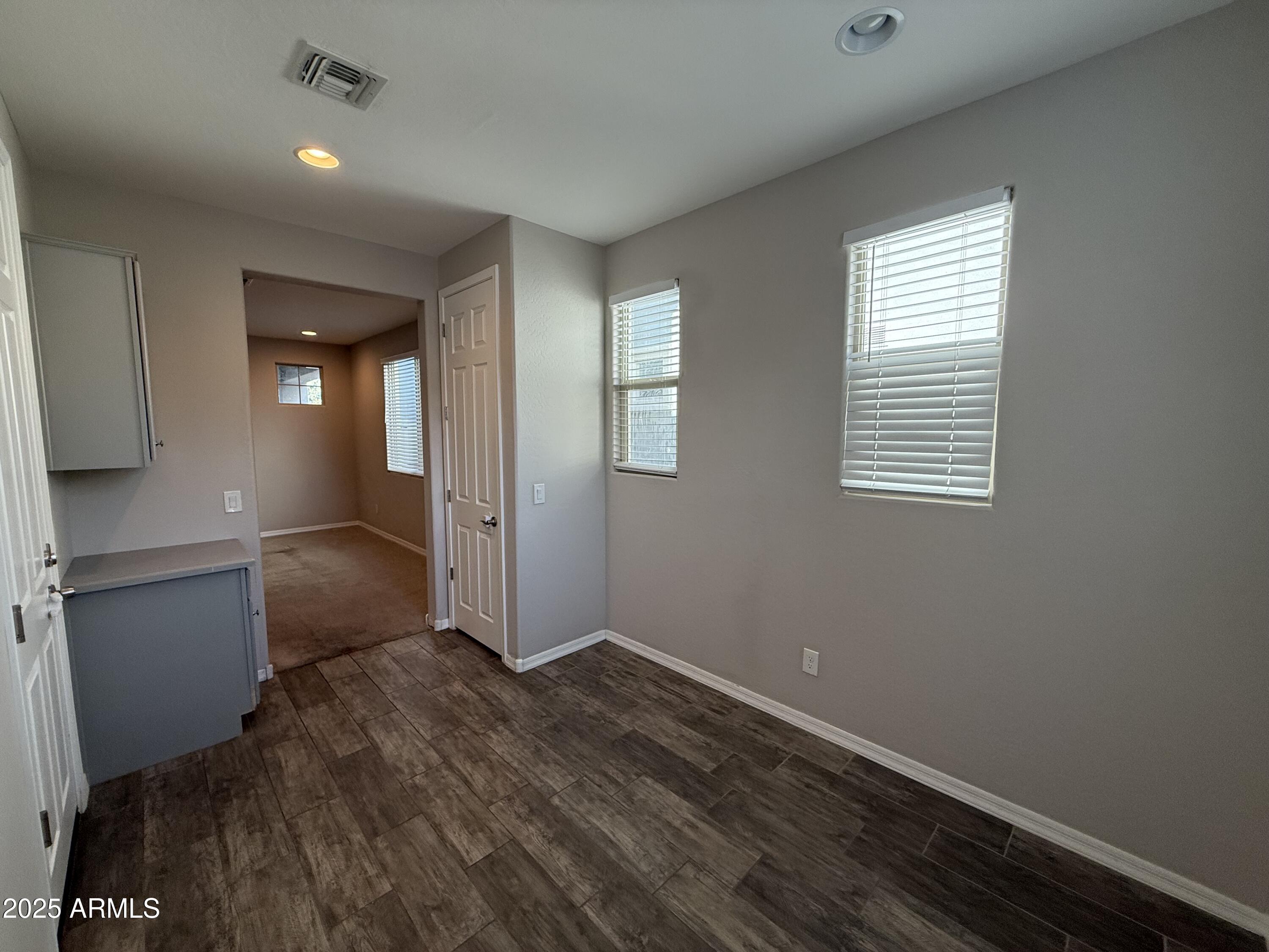3786 East Robert Street Gilbert, AZ 85295 - Photo 10 of 22 wooden floor in an empty room with a window