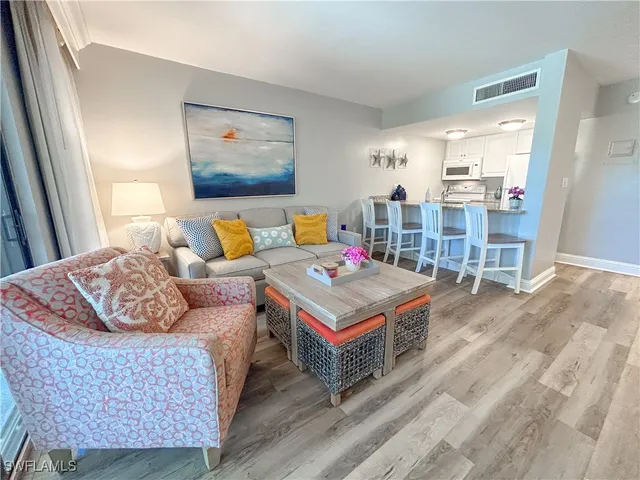 a living room with furniture and a table