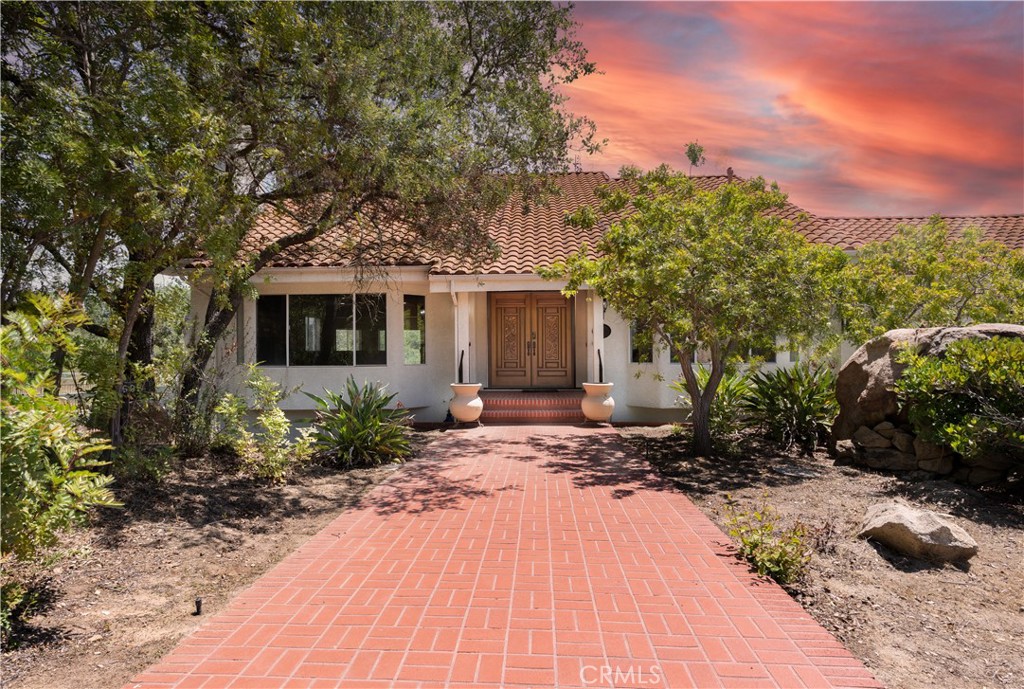19605 Carancho Road Temecula, CA 92590 - Photo 1 of 1 a front view of a house with a yard