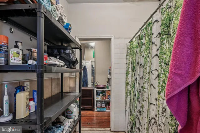 a view of a entryway with furniture and wooden floor