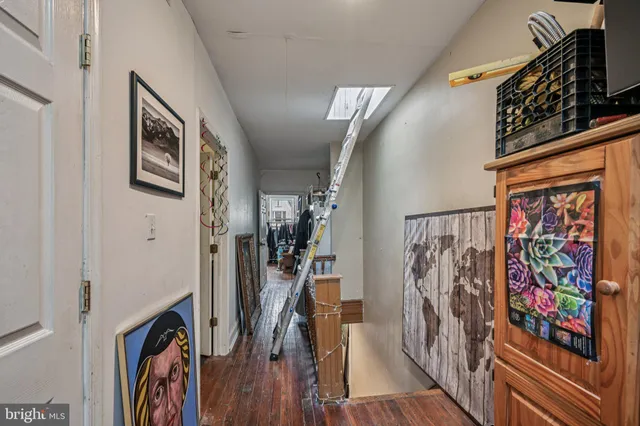 a bathroom with a sink toilet and a mirror