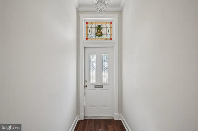 a view of an entryway with wooden floor