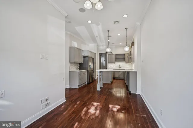a view of a kitchen and dining room