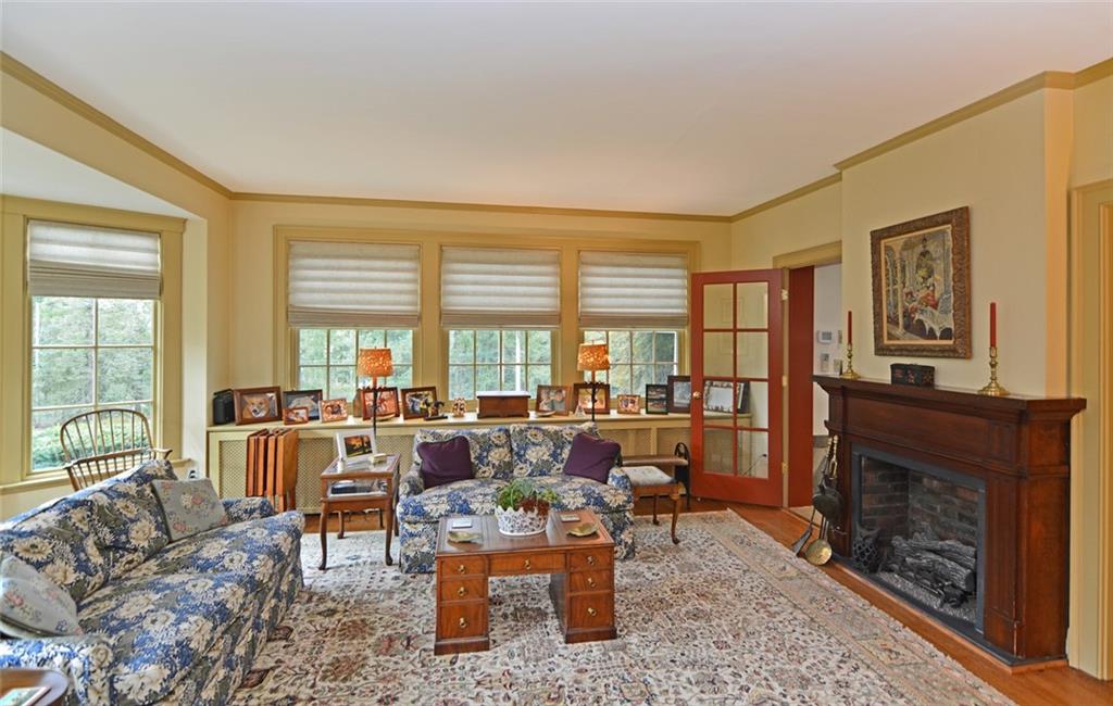 407 Rhodora Lane Pittsburgh, PA 15238 - Photo 21 of 48 a living room with furniture large window and a fireplace
