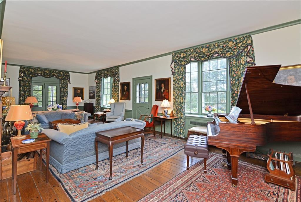 407 Rhodora Lane Pittsburgh, PA 15238 - Photo 22 of 48 a living room with furniture a rug and a flat screen tv